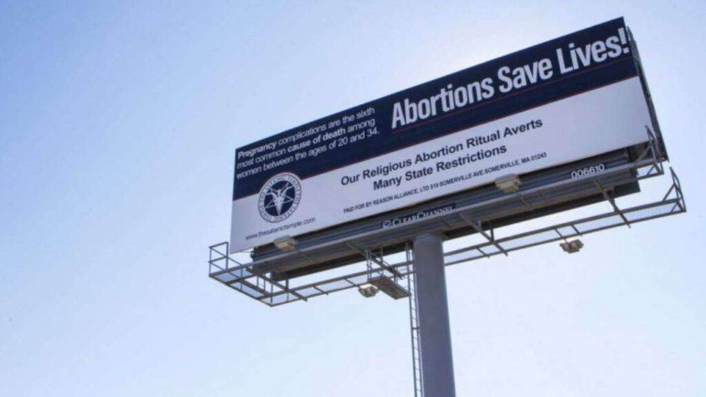 cartellone aborto satanisti
